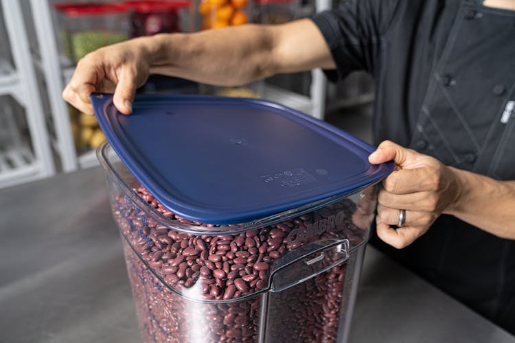 Chef placing Easy Seal Cover on 12 QT CamSquare FreshPro Container